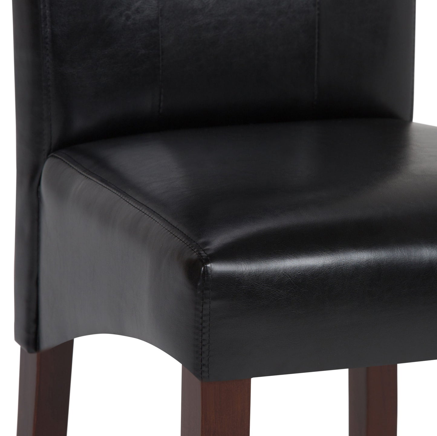 Close-up of the Cosmopolitan - Deluxe Tufted Parson Upholstered Chair, showcasing its black leather seat and backrest with dark wooden legs. The visible stitching and smooth leather texture highlight its elegant design. Comes as a set of 2.