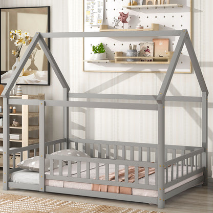 The room features a Floor Wooden Bed With House Roof Frame and Fence Guardrails, low to the floor with a pink-and-gray polka dot blanket, shelves with decor, a rug, cabinet, and soft natural light.