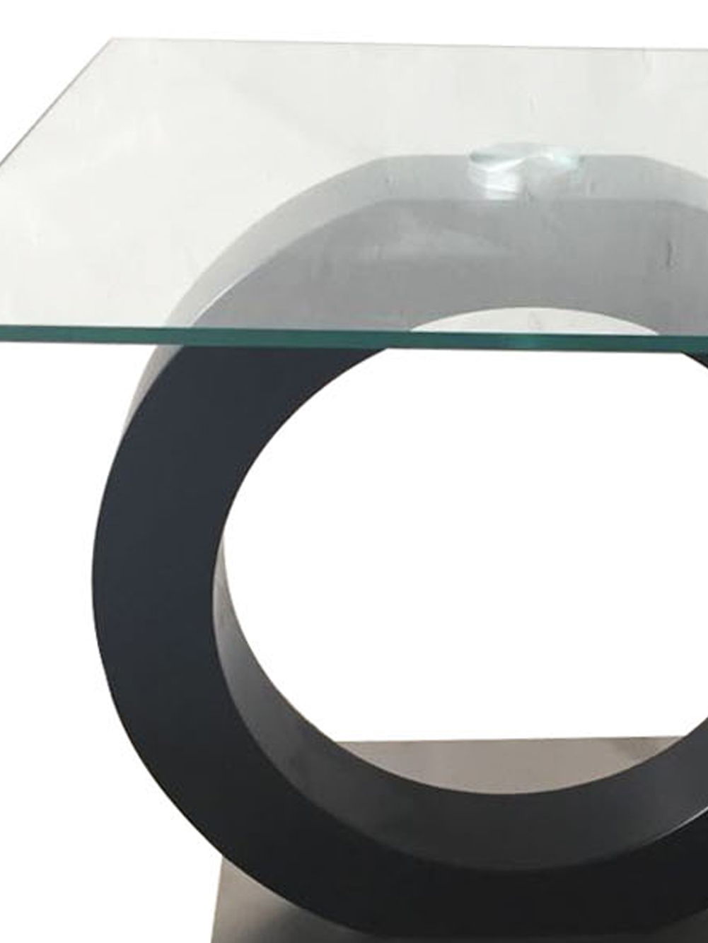 The Everest - Stylish Design Table features a geometric, minimalist design with a square glass top and a round black base, offering a modern look.