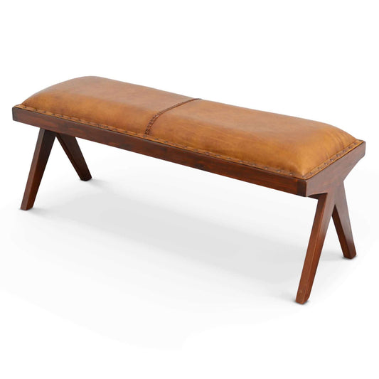 The Chad Mid-Century Modern Leather Bench in brown/tan features angled wooden legs and a cushioned leather seat with visible edge stitching, showcased against a plain white background.