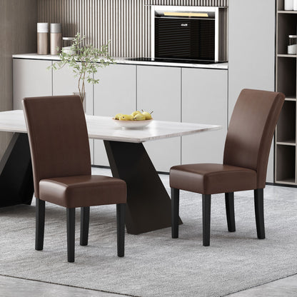 A set of two Contemporary Dining Chairs with rubberwood legs sits near a modern white table on a grey rug in a neutral, minimalist kitchen and dining space.