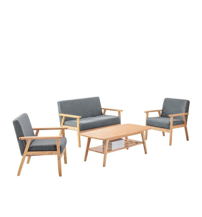 The Bahamas Living Room Set features two gray cushioned armchairs, a matching two-seater sofa, and a light wood coffee table with a slatted shelf, arranged against a white background.
