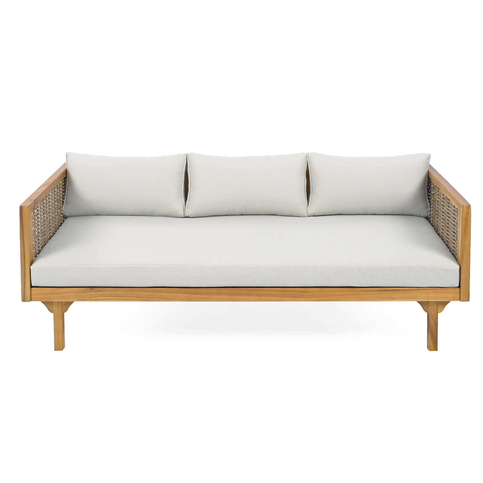 The Claremont 3 Seater Daybed features a modern design in teak and acacia wood with water-resistant light beige cushions and woven rattan side panels, shown from the front against a white background.