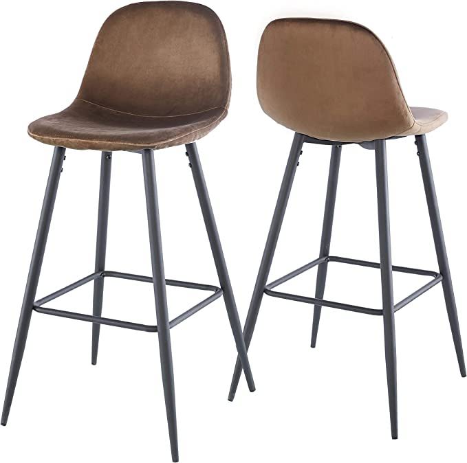 A set of two brown Velvet Barstools With Back, armless and featuring curved backs, black metal legs with footrests. Both barstools are angled to show front and back views.