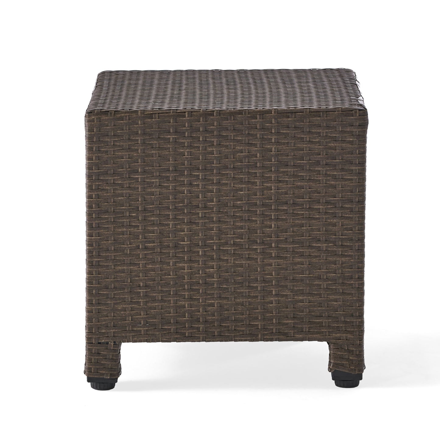 The Puerta Minimalist Style Accent Table features a square design with a flat top and short legs, crafted from brown woven rattan and shown against a white background.