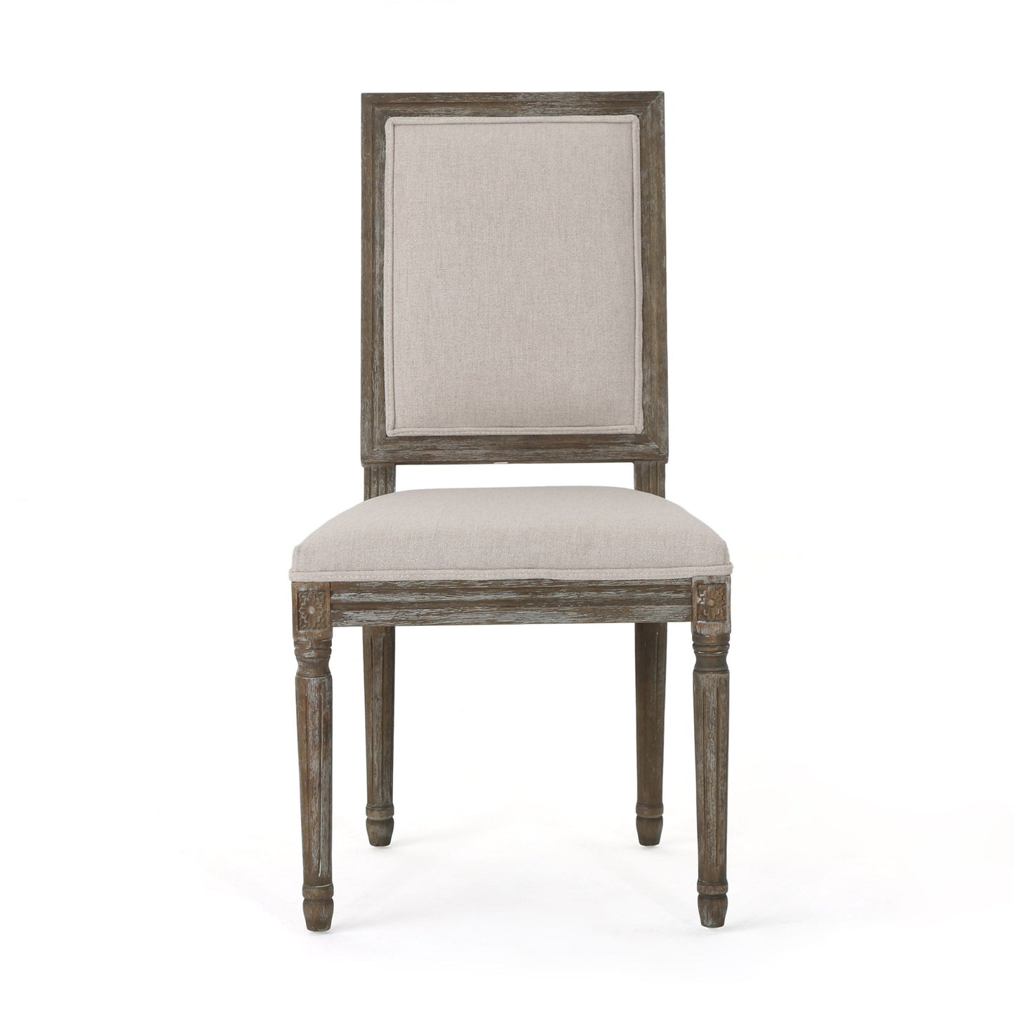 Front view of the Traditional Style Dining Chair Set With Fabric Upholstery featuring a rectangular, padded beige fabric seat and backrest, carved leg detailing, and weathered wood finish.