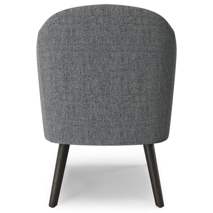The Redding Upholstered Accent Chair features a rounded backrest in textured gray fabric and four angled dark wooden legs, shown from the back.