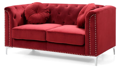 The Stylish Sloped Arm Loveseat in red velvet features two round, tufted throw pillows, silver stud accents on the arms and base, and sturdy metal legs.