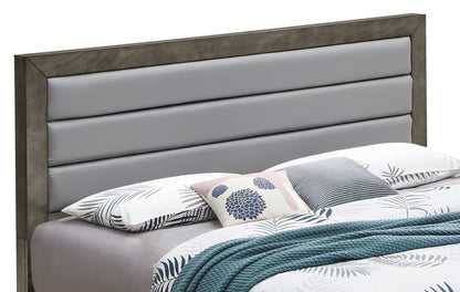 The Transitional Modern Design Bed features a gray upholstered headboard, light floral and leaf-patterned bedding, a blue throw blanket, and decorative pillows in assorted patterns and colors.