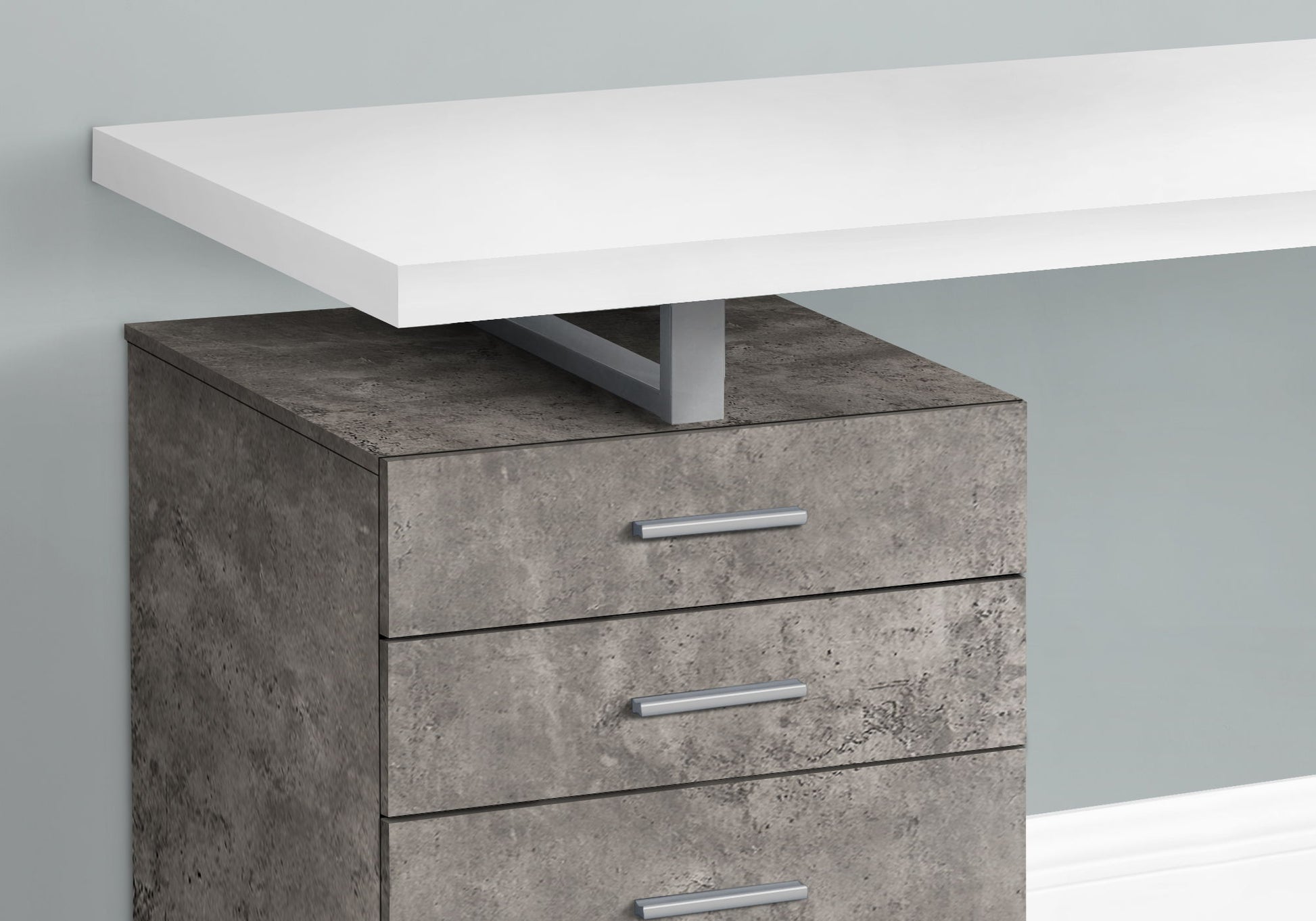 The Computer Desk Left Right Set-Up Storage Drawers For Home Office features a modern white tabletop, sturdy metal bracket, and a gray concrete-textured three-drawer unit with sleek silver handles.