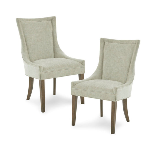 The Ultra - Elegant Dining Side Chair (Set of 2) features light beige upholstery, gently curved backs, and dark wooden legs, shown here on a white background.