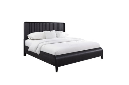 The Waterfall Panel Bed features a dark wooden frame and headboard, styled with crisp white bedding, pillows, and a blanket, set against a plain white background.