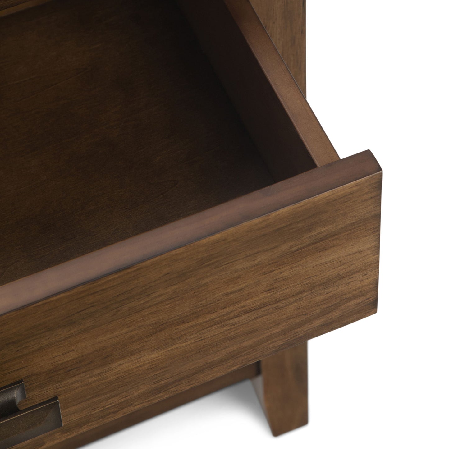 A close-up of the Artisan - Handcrafted Bedside Table shows an empty wooden drawer partially pulled out, highlighting its smooth finish and simple handle design.