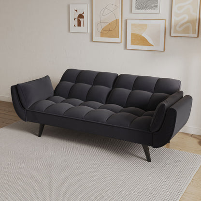 A Sofa Soft with two armrests and throw pillows sits on a light gray rug. Abstract framed art hangs on the white wall above, and a wood floor completes the modern small space apartment or bedroom look.