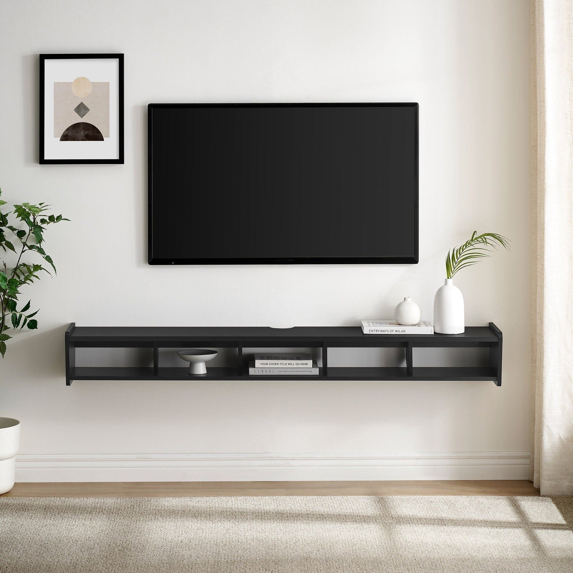 A modern living room with a wall-mounted flat-screen TV on a Modern Wall-Mounted Floating TV Stand, holding books, a bowl, and a plant; plus a framed abstract art print and a green plant in the corner.