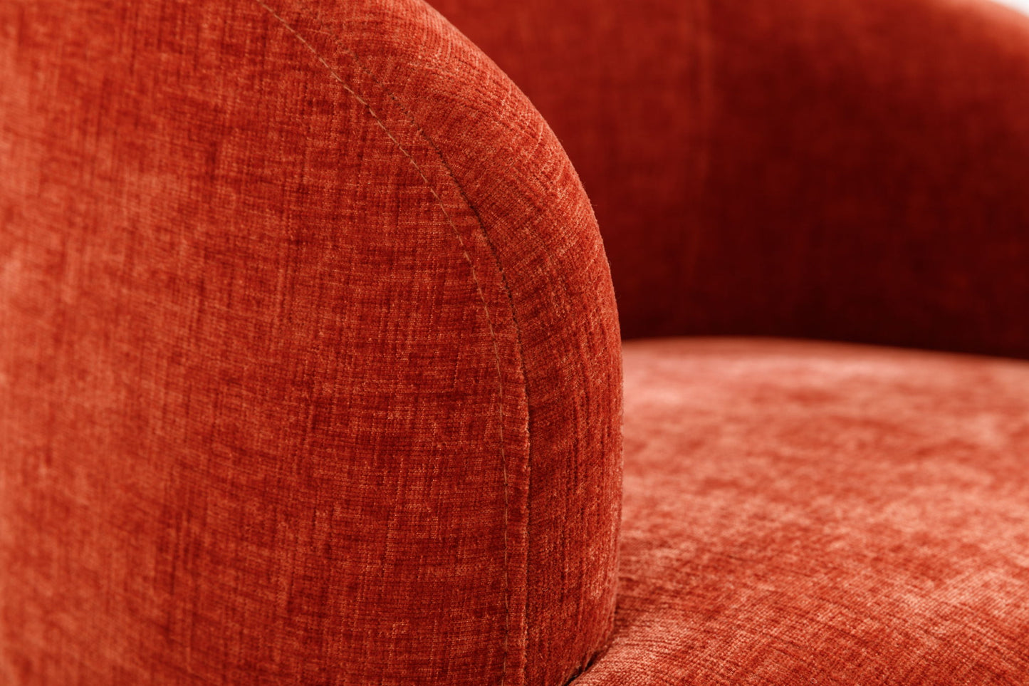 Close-up of a curved armrest and seat of the Chenille Fabric Swivel Accent Armchair Barrel Chair with powder-coated metal ring, highlighting its red textured upholstery and detailed stitching.