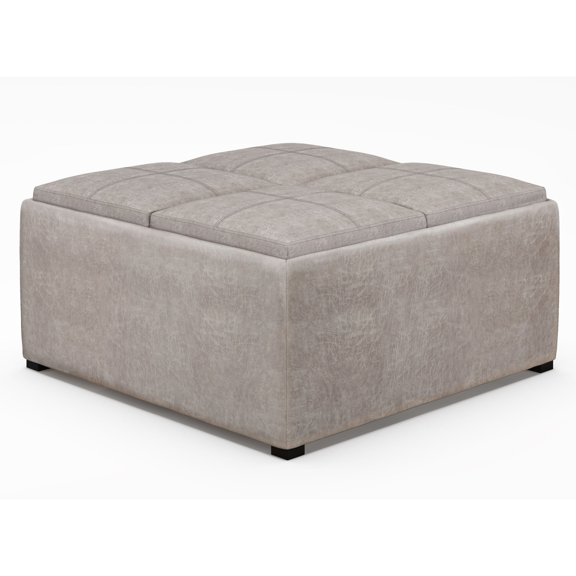 The Avalon Square Coffee Table Storage Ottoman features a large, light gray upholstered design with a tufted top and low black feet, shown against a plain white background.