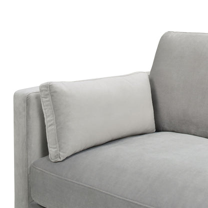 A close-up of the Knox - Modern Farmhouse Sofa in light gray, featuring a soft, plush fabric and a matching rectangular pillow resting against the armrest and backrest.