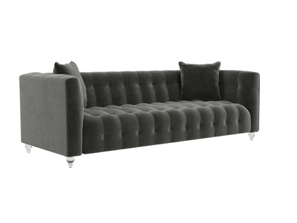 Introducing the Bea Velvet Tufted Sofa, a grey velvet masterpiece featuring a classic design with two cushions. This sofa boasts a long, plush seat and backrest adorned with elegant button detailing. It stands on short, cylindrical legs in a contrasting light color for added style.