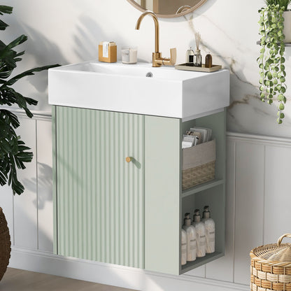 The Modern Floating Bathroom Vanity With Ceramic Basin features a white rectangular sink, gold faucet, and pastel green ribbed cabinet with open shelves for baskets and toiletries. Decorative plants and marble walls complete the look. Perfect for small bathrooms.