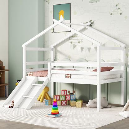 A children’s bedroom features the Low Loft House Bed With Slide, Ladder, Safety Guardrails, and House Roof Frame in white, surrounded by toys and books. Playful wallpaper and child’s artwork create a cozy and fun play area.