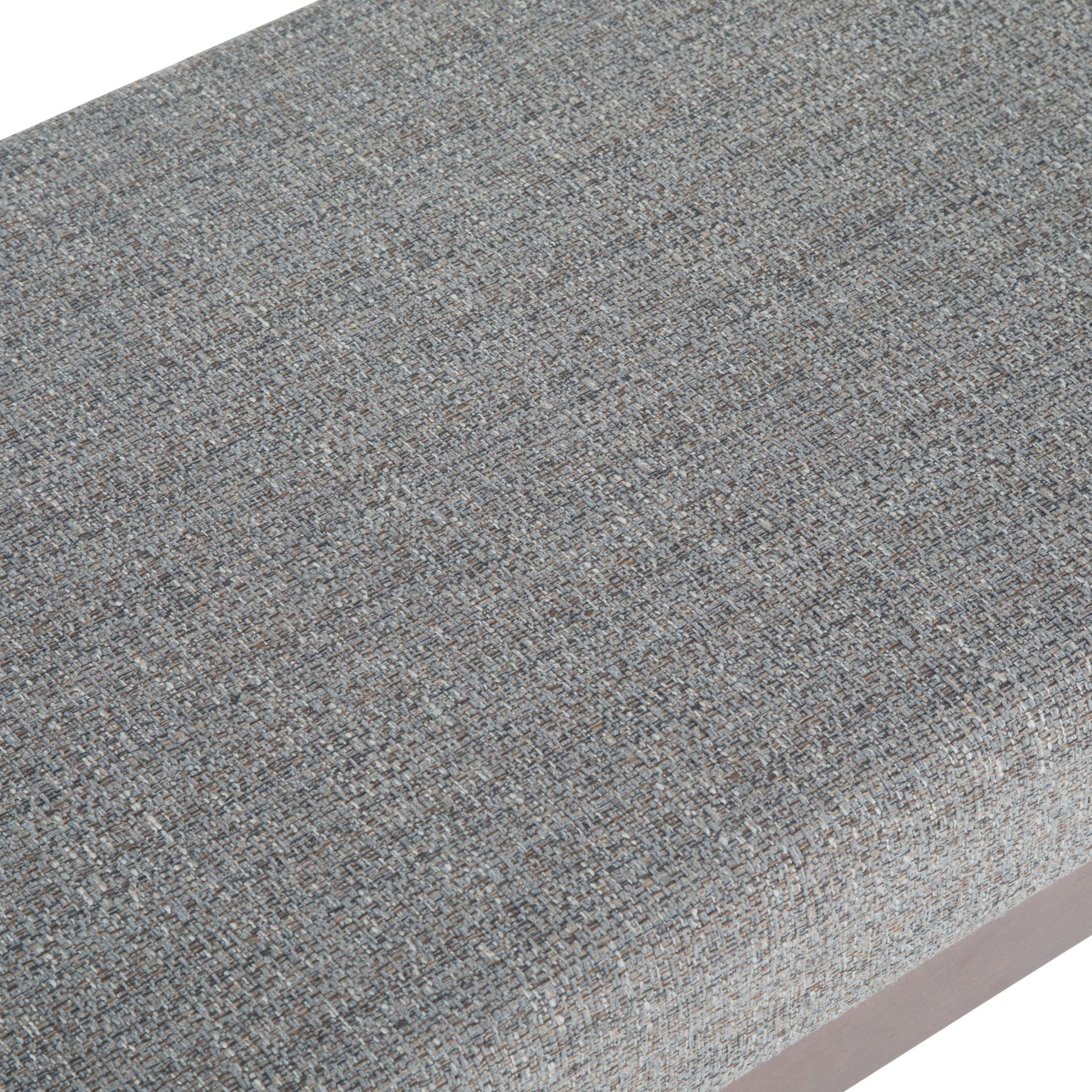 Close-up of the Chanelle - Mid-Century Ottoman Bench, featuring textured, woven gray fabric with subtle color variations that highlight the detailed pattern of its upholstery.