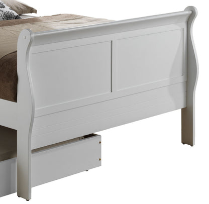 The Elegant Trundle Bed With Timeless Charm features a high footboard, panel detailing, and under-bed storage shown with its drawer pulled out. The bed is partially made up in beige and brown bedding.