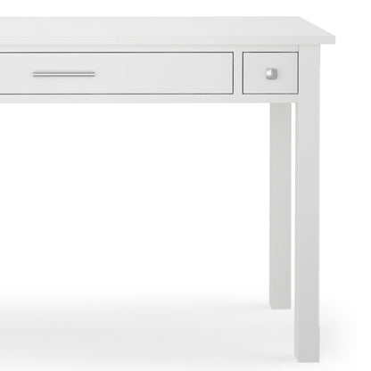 The Avalon Handcrafted Writing Office Desk is a modern white desk with a spacious center drawer and a small right-side drawer, both with simple metal handles, shown against a plain white background.