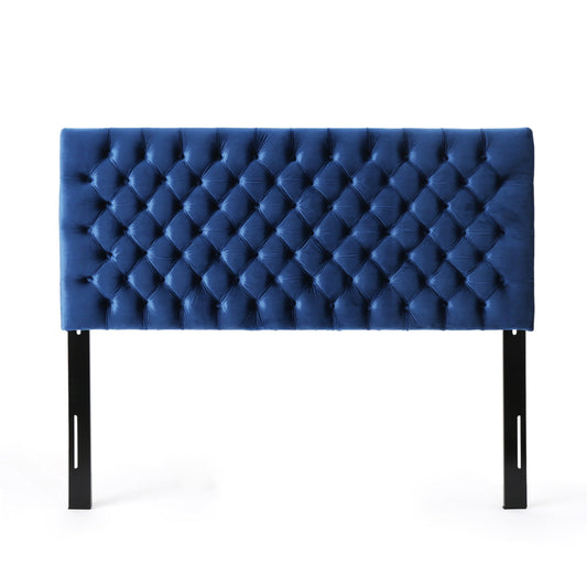 The Annecy - Contemporary Upholstered Headboard is shown in blue with a tufted diamond pattern and two black wooden legs, set against a white background.