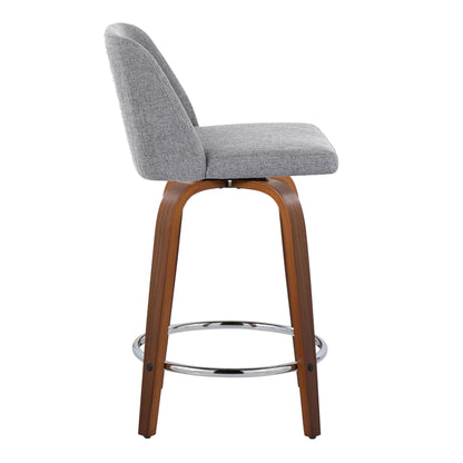 The Toriano stool is a mid-century modern counter stool with a gray cushioned seat and backrest, wooden legs, and a round metal footrest. Side view included. Available as a set of 2 with swivel feature.