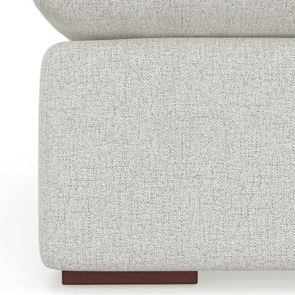 Close-up of the corner of the Jasmine - Handcrafted Sofa, featuring modern light gray textured upholstery and a short rectangular dark wooden leg.