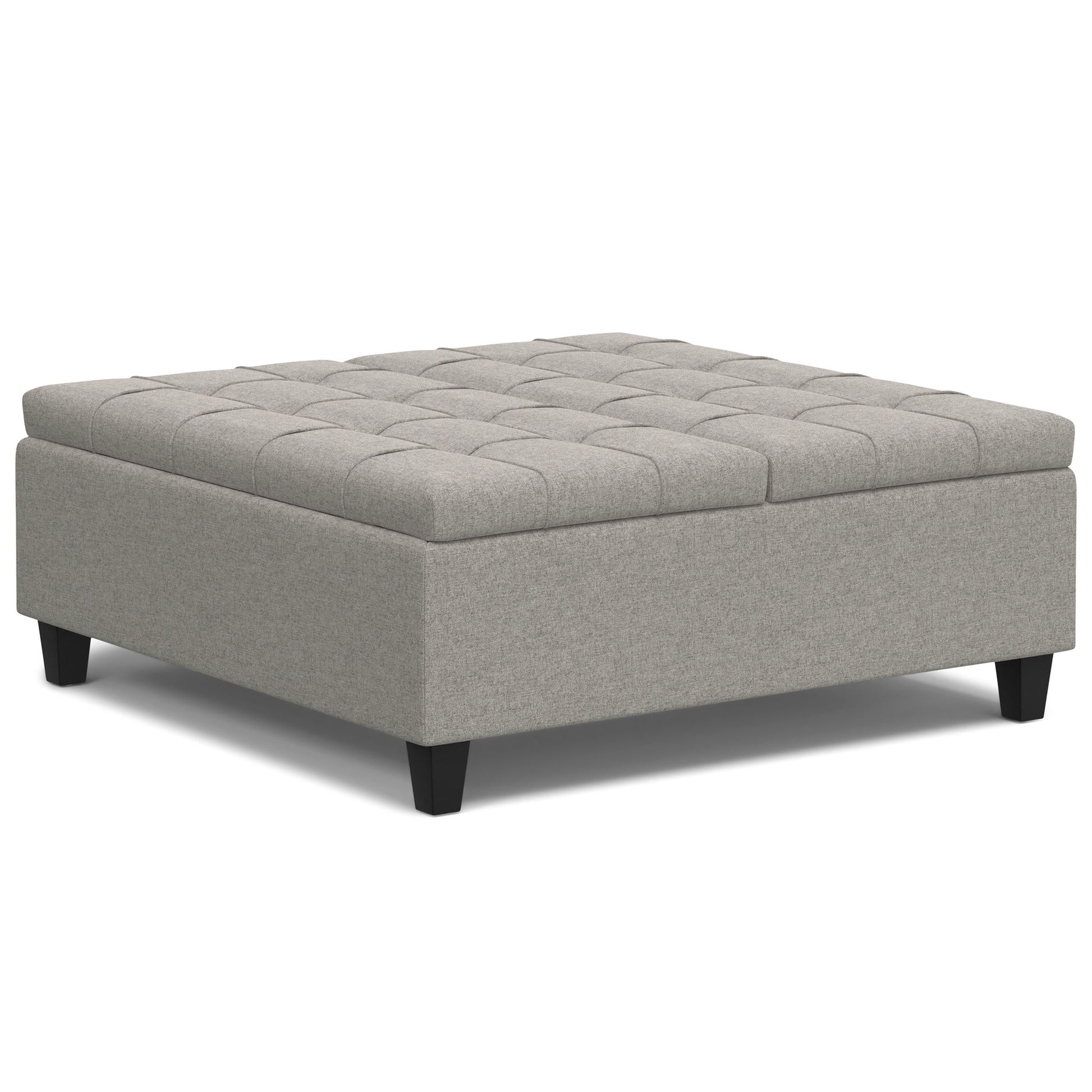 The Harrison - Upholstered Coffee Table Storage Ottoman features a square, light gray tufted top and short black legs, shown against a white background.