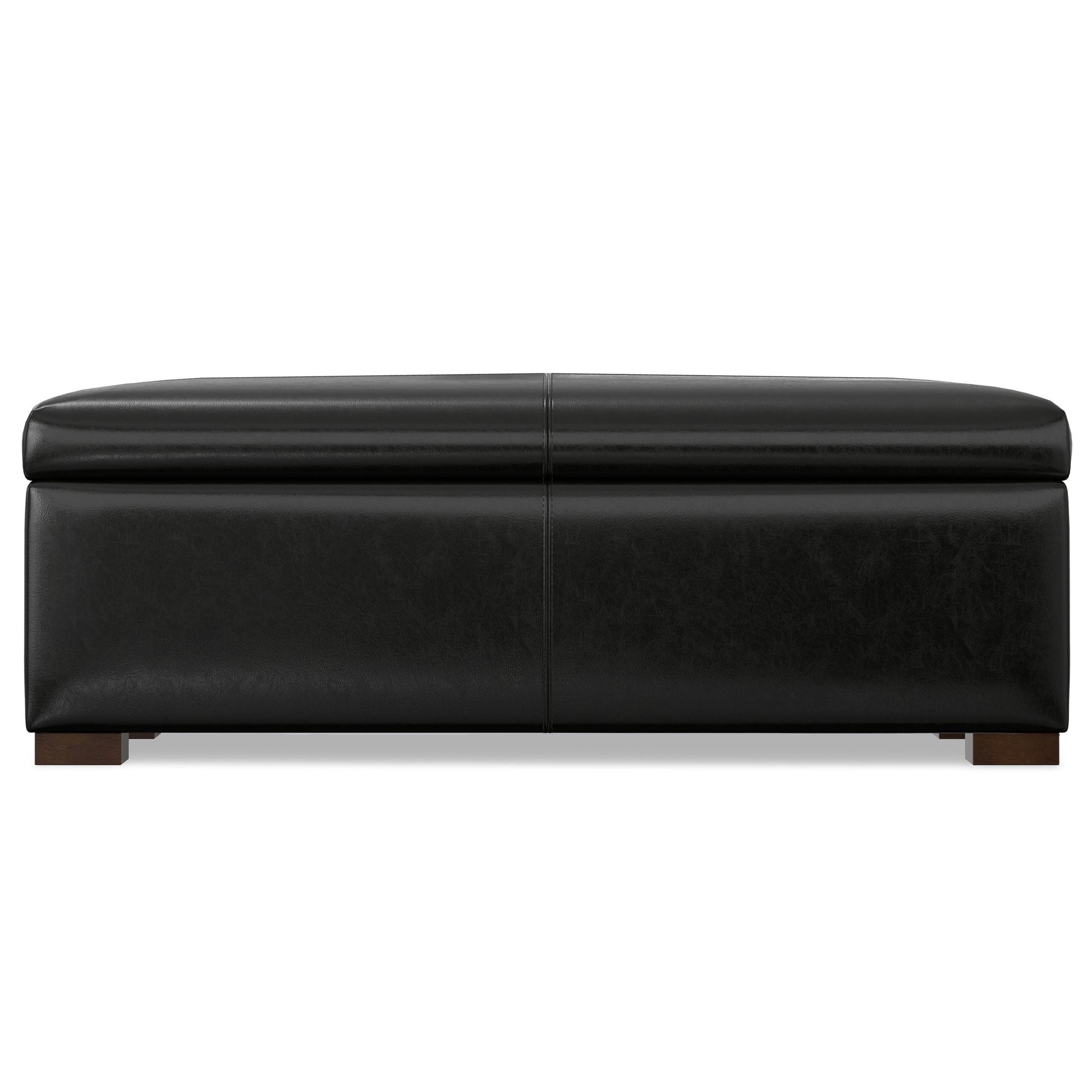 The Gabbie Coffee Table Upholstered Storage Ottoman features a rectangular black leather design with a cushioned top and short wooden legs, shown from the front.