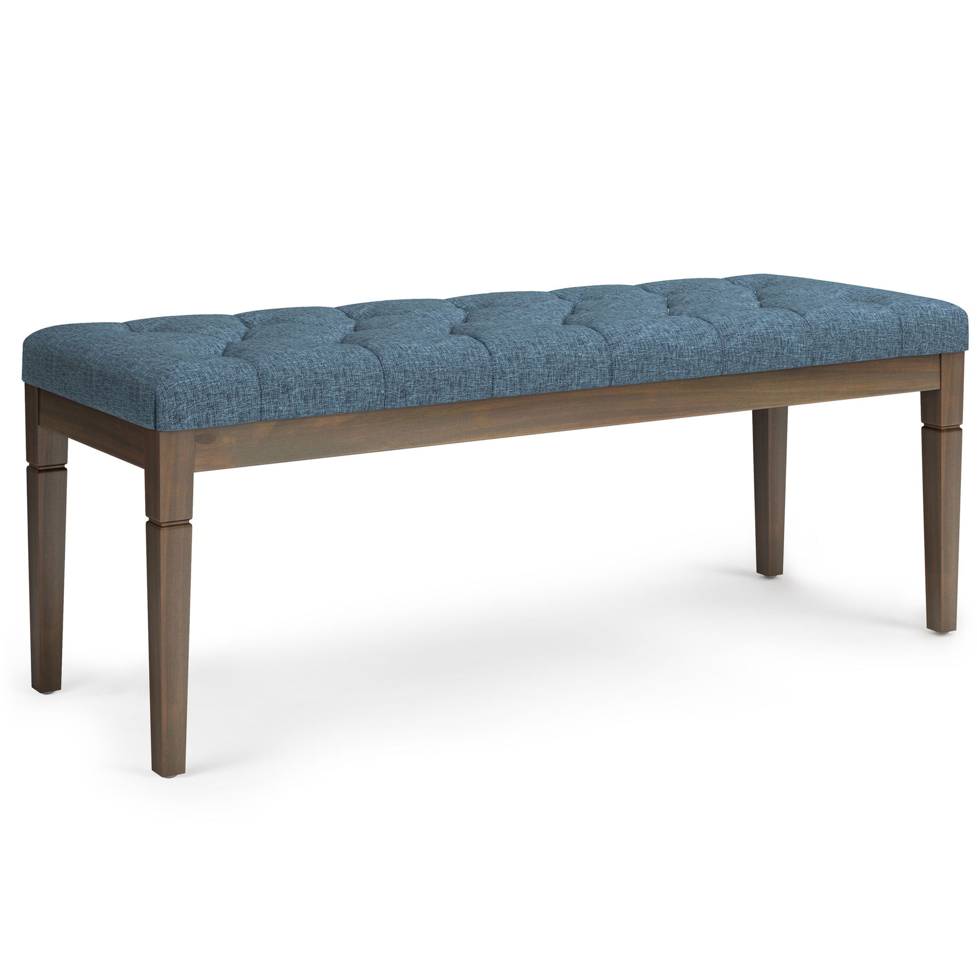 The Waverly Upholstered Tufted Ottoman Bench features a blue finish and sturdy wooden legs.