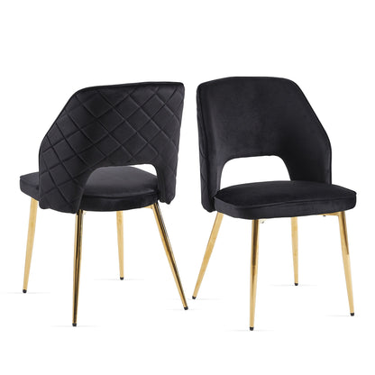 Set of two Velvet Dining Chairs With Metal Legs And Hollow Back, featuring black quilted upholstery, open lower back design, and gold metal legs. Chairs are shown from front and back on a white background.
