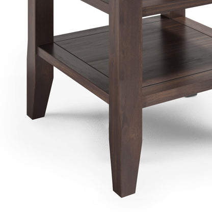 Close-up of the lower section of the Acadian End Table in warm walnut brown, featuring tapered legs and a lower shelf, set against a white background.