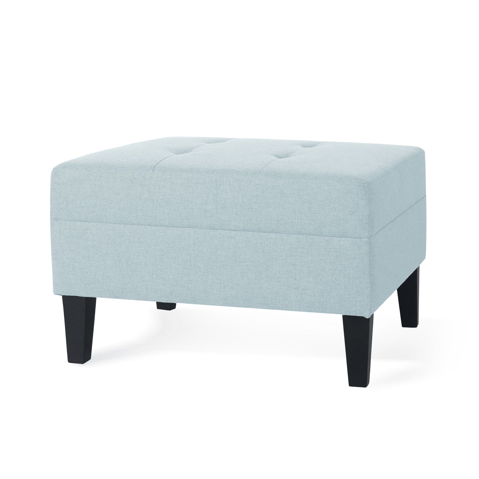 A Classic Ottoman with birch wood legs and fabric upholstery in light blue, featuring a rectangular shape, tufted top, and four black wooden legs, displayed against a white background.