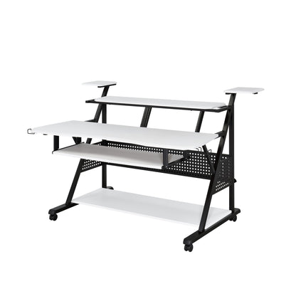 The Willow - Versatile Music Desk features a modern, multi-level white and black design with shelves, a raised monitor platform, pull-out keyboard tray, caster wheels for mobility, and a metal frame with perforated accents.