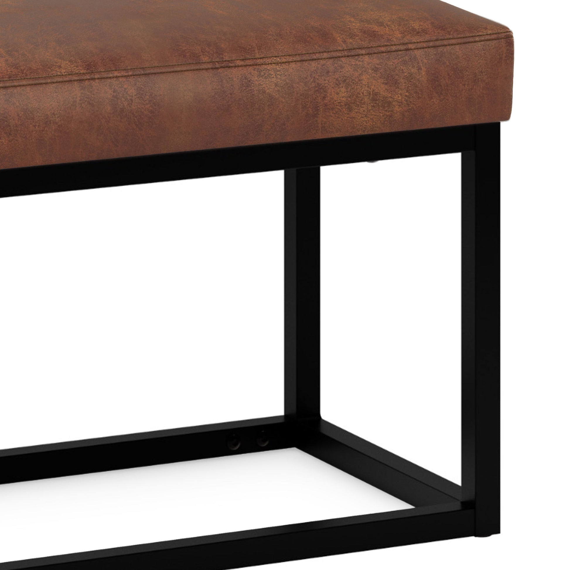 Side view of the Reynolds - Small Bench in Distressed Saddle Brown, featuring a brown leather cushion and black metal frame, set against a white background.