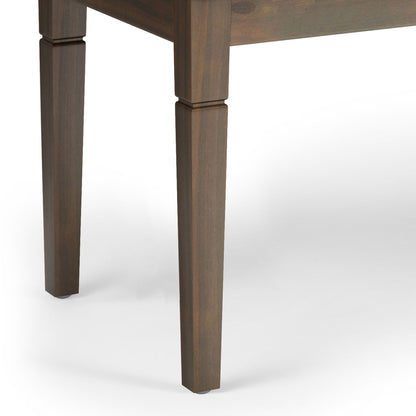 Close-up of two dark wooden legs from the Waverly - Upholstered Tufted Ottoman Bench, shown against a white background. The straight legs feature a slight taper and a decorative groove near the top.
