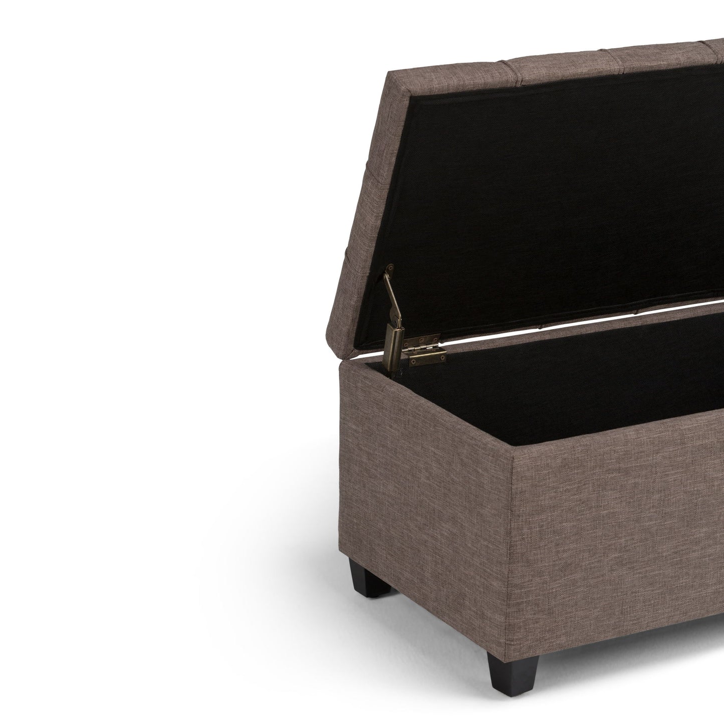 The Sienna Upholstered Storage Ottoman Bench features a brown finish, hinged lid, and spacious black interior. It stands on four short black legs and is shown against a white background.