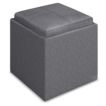The Rockwood Upholstered Cube Storage Ottoman With Tray features a square, gray design with a cushion top and subtle stitching, shown on a white background.