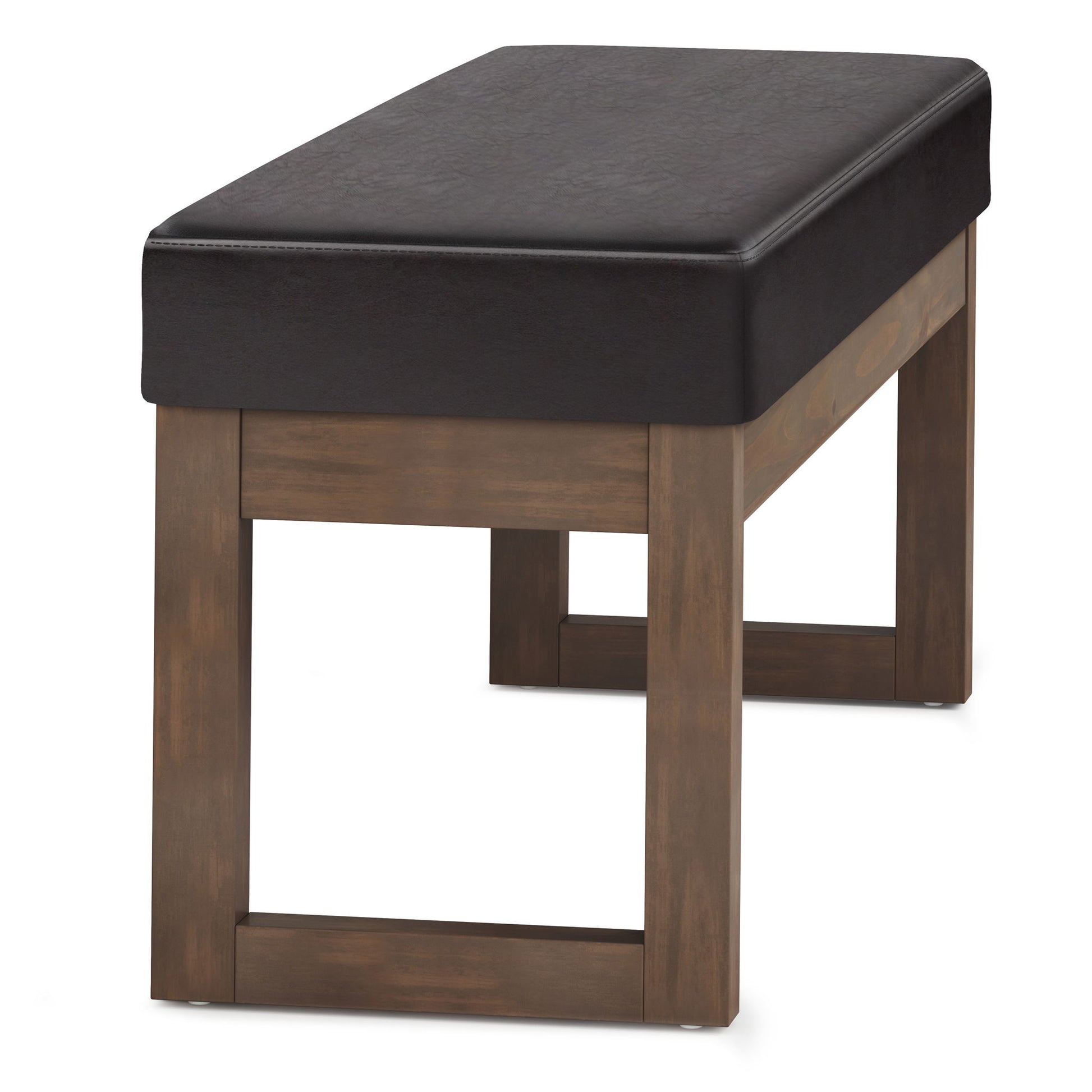 The Milltown Upholstered Ottoman Bench features a rectangular shape with a dark cushioned seat, wooden legs, and a simple modern design.