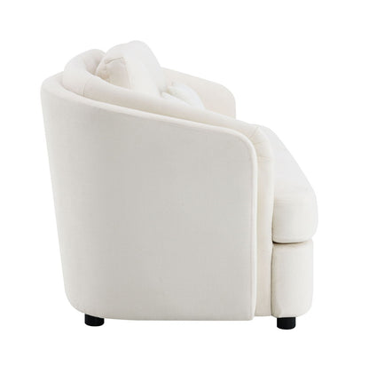 Side view of the Mariko Linen Sofa in beige, featuring plush upholstery, rounded edges, two toss pillows, and short black legs, shown against a plain white background.
