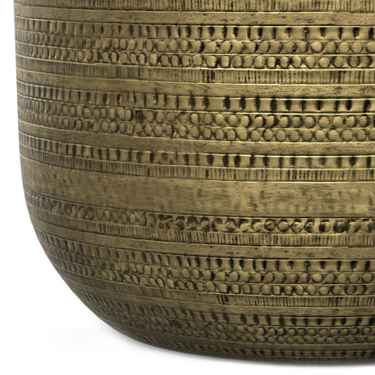Close-up of the Johnsen Handcrafted Metal Coffee Table, featuring a brass-toned finish with intricate horizontal embossed patterns of alternating dots and lines.