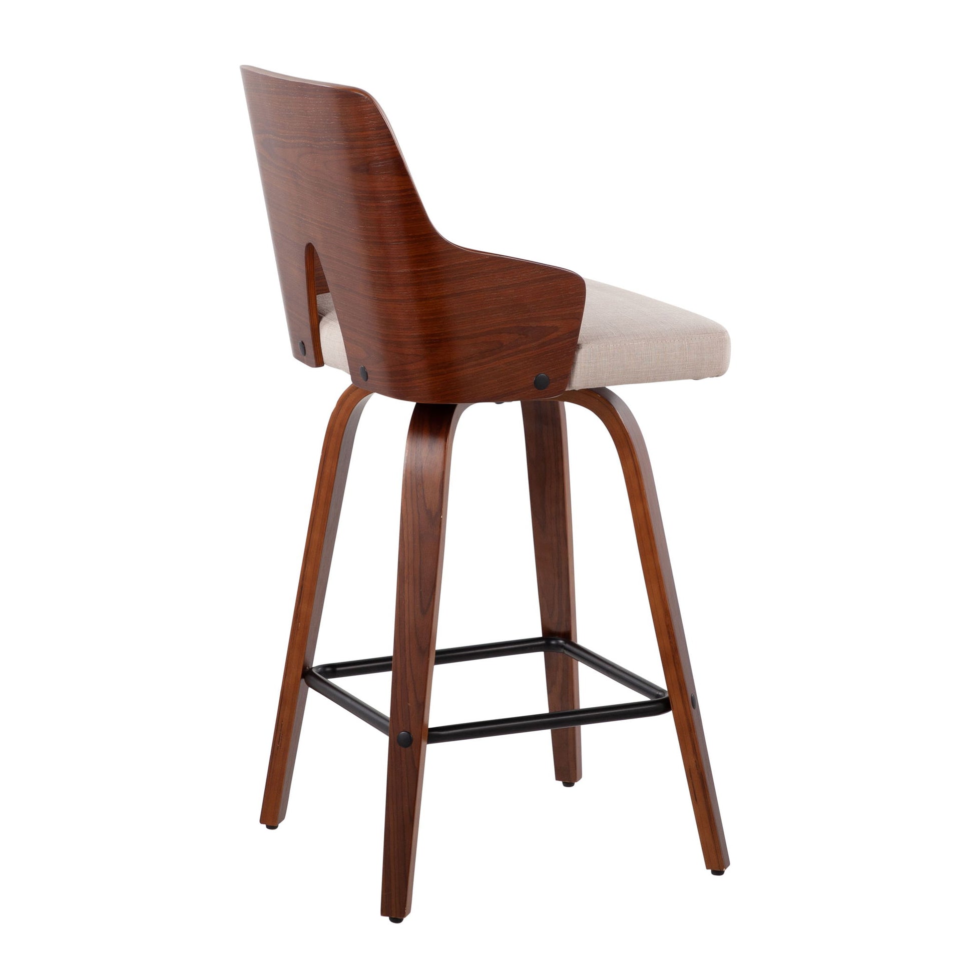 The Ariana - Mid Century Modern Counter Stool (Set of 2) features a curved wooden backrest, wooden legs, beige upholstered seat, and black metal footrest, shown from an angled rear view.
