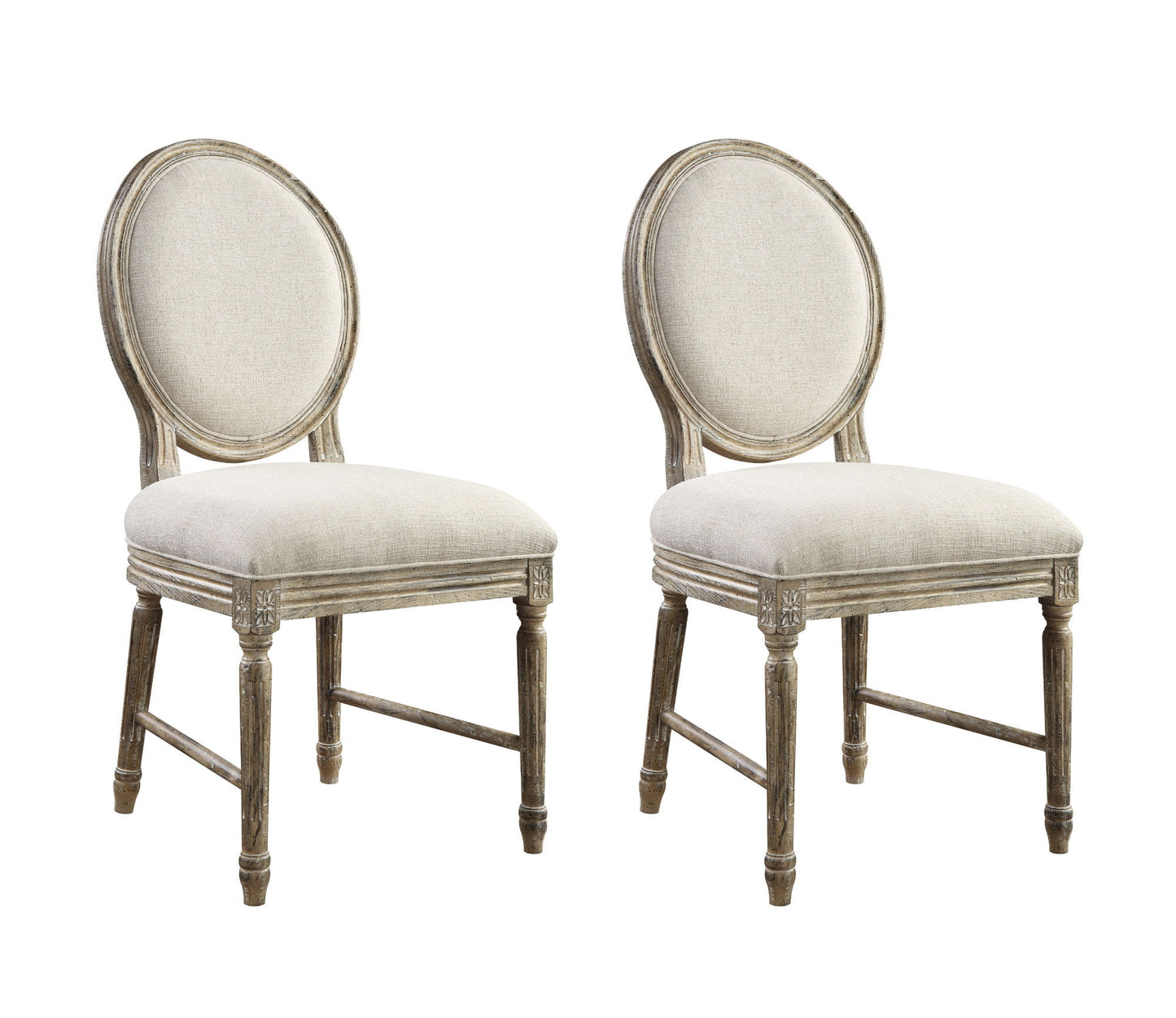 The Ludin Upholstered Dining Chairs (Set of 2) in brown feature round, cushioned backs and seats, weathered wood frames with carved accents, and tapered legs for a classic vintage look.