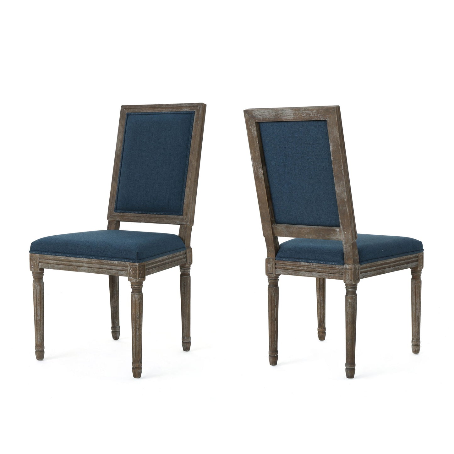 Set of two Traditional Style Dining Chairs with dark blue fabric upholstery, rustic weathered wood finish, square backs, and straight fluted legs. One chair is facing forward, the other is angled backward.