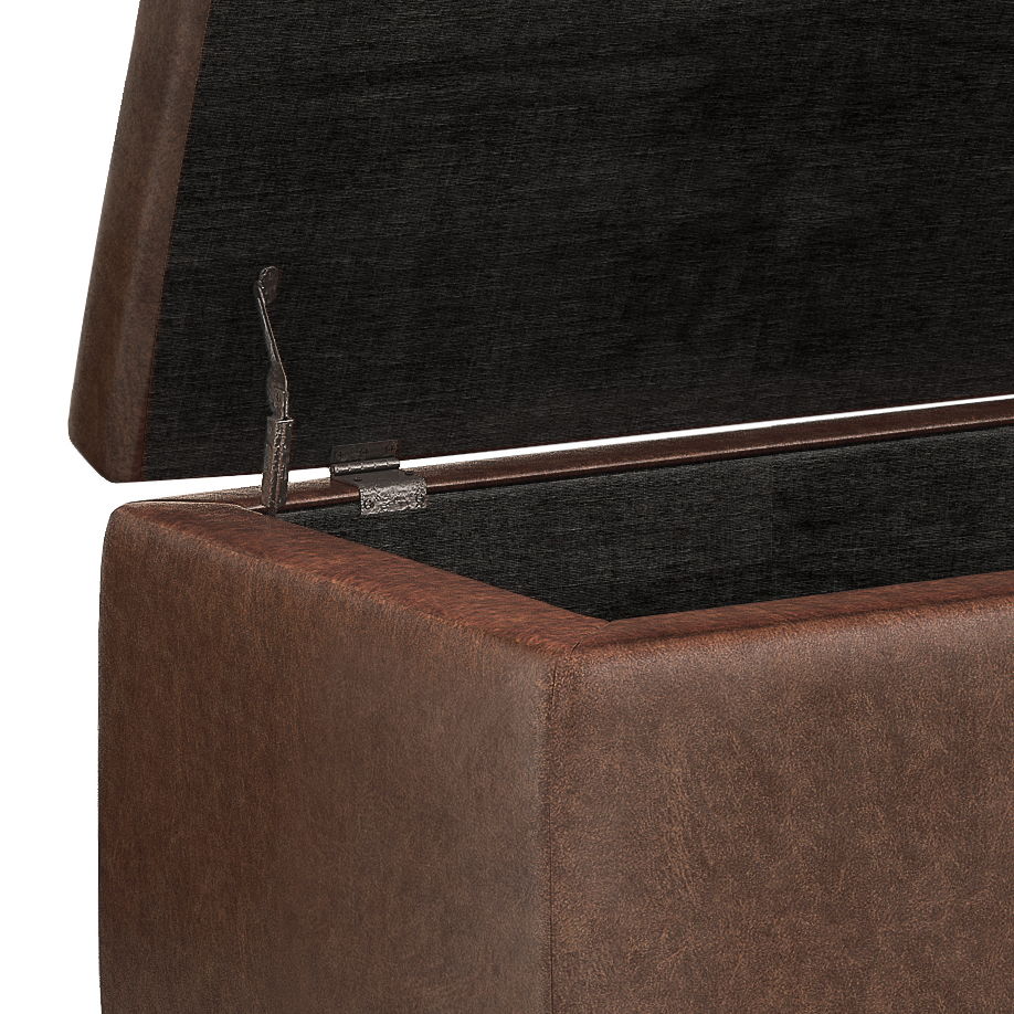 A close-up of the Hamilton - Upholstered Storage Ottoman, highlighting its hinged lid and spacious dark interior.