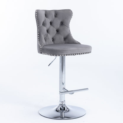 The Swivel Velvet Barstools, set of 2, feature tufted grey backs, chrome adjustable bases (25-33" seat height), round cushioned seats, silver nailhead trim, and footrests—perfect for home pubs or kitchen islands. Shown on a plain white background.